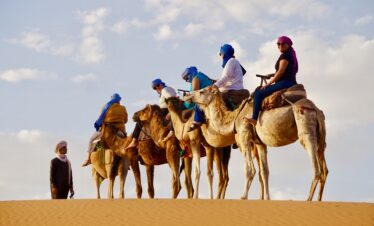 Trekking across the Sahara dunes near M’hamid El Ghizlan