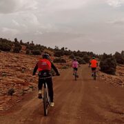 Small group gravel bike tour on a dirt road in the High Atlas Mountains, Morocco