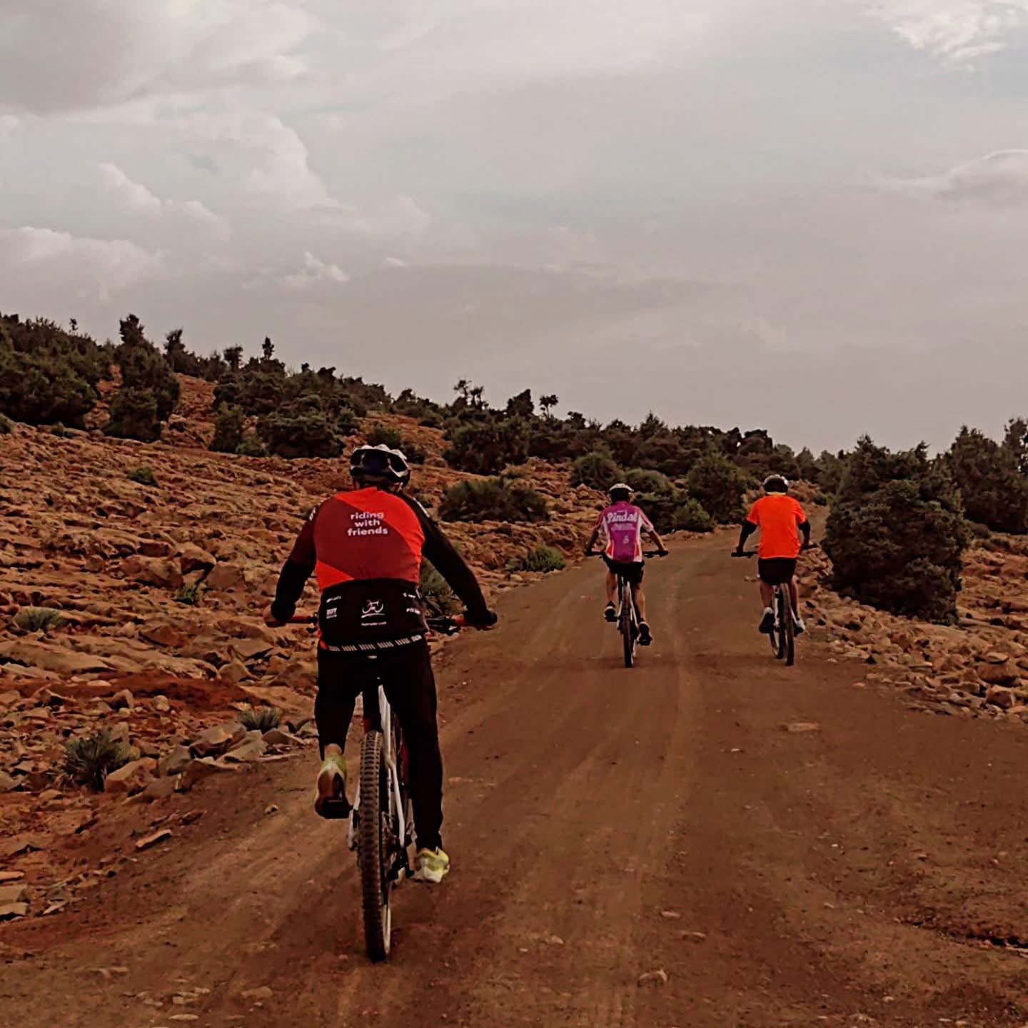 Small group gravel bike tour on a dirt road in the High Atlas Mountains, Morocco